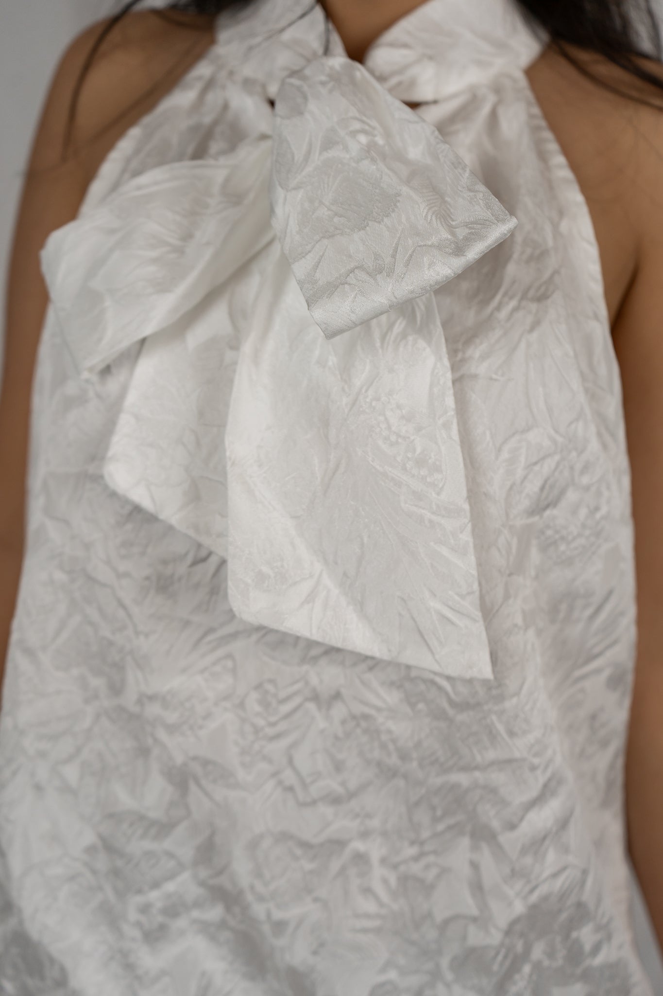 Textured adjustable neck bow dress